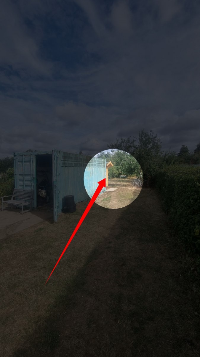 Located behind the green container Located behind the green container